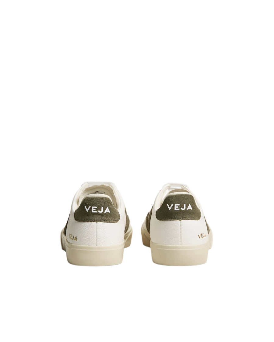 Pair of white sneakers with 'VEJA' branding on a light gray background