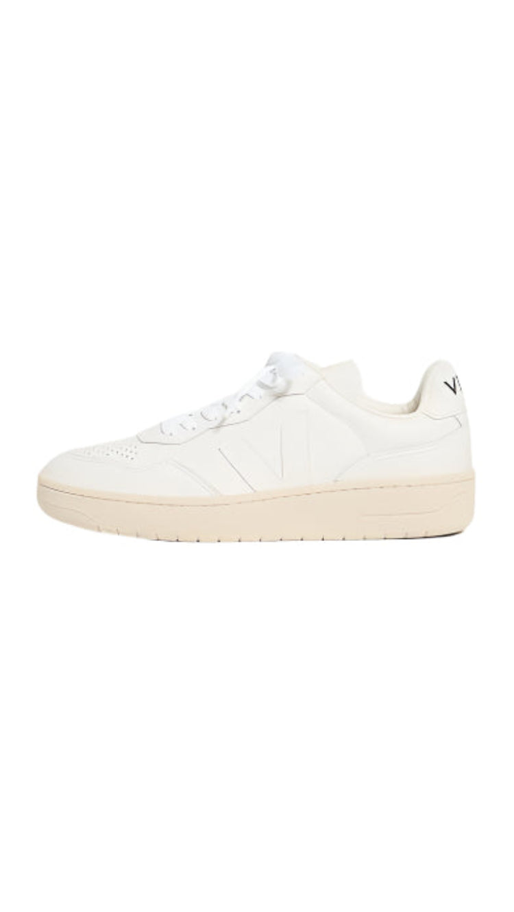 White sneaker with a brand logo on a white background