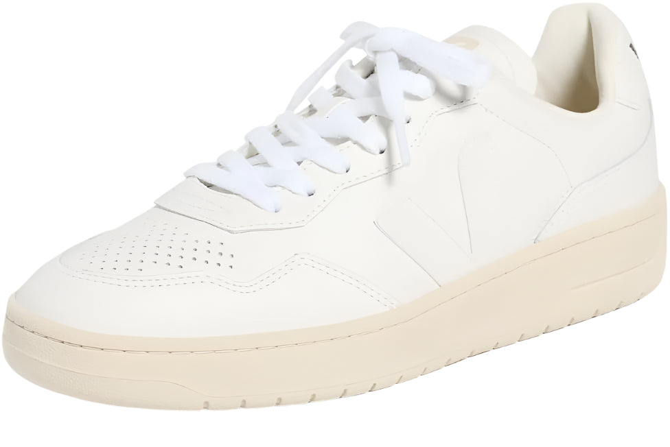 White sneaker with a light brown sole on a white background