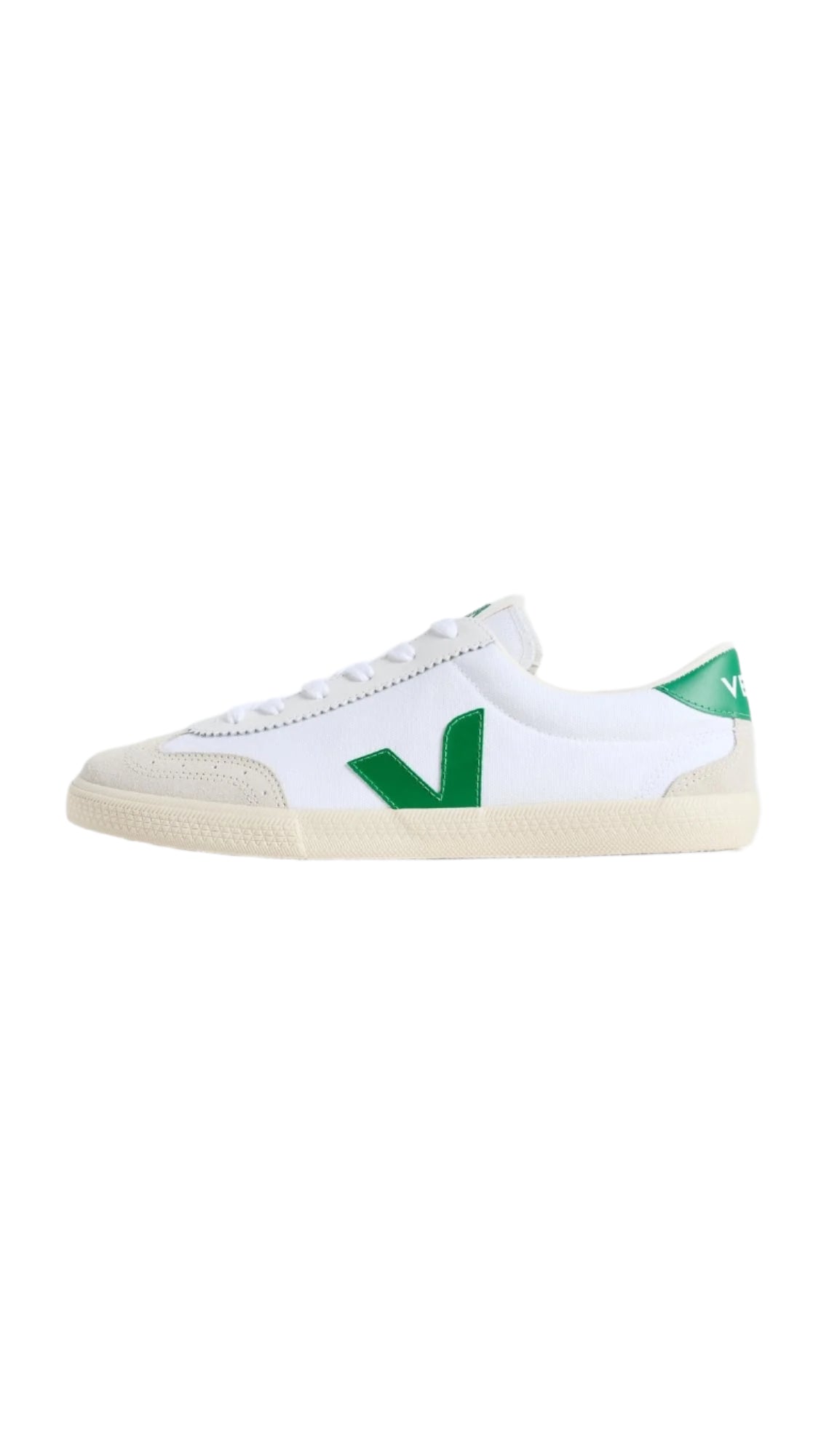 White sneaker with green accents on a light gray background