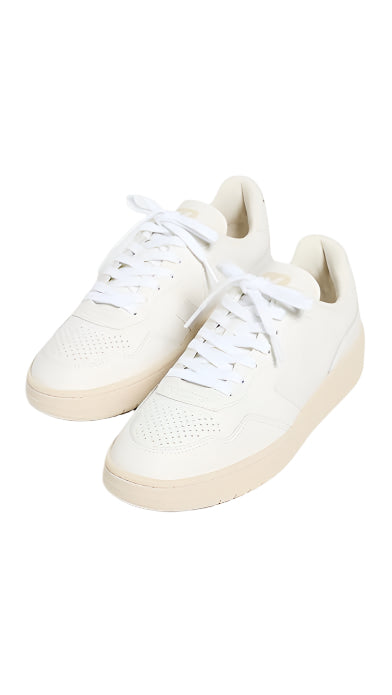 White sneakers with beige soles on a white background