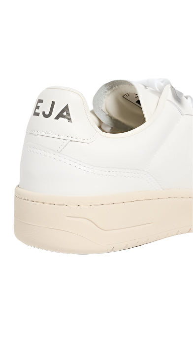 White sneaker with 'EJA' branding on a white background