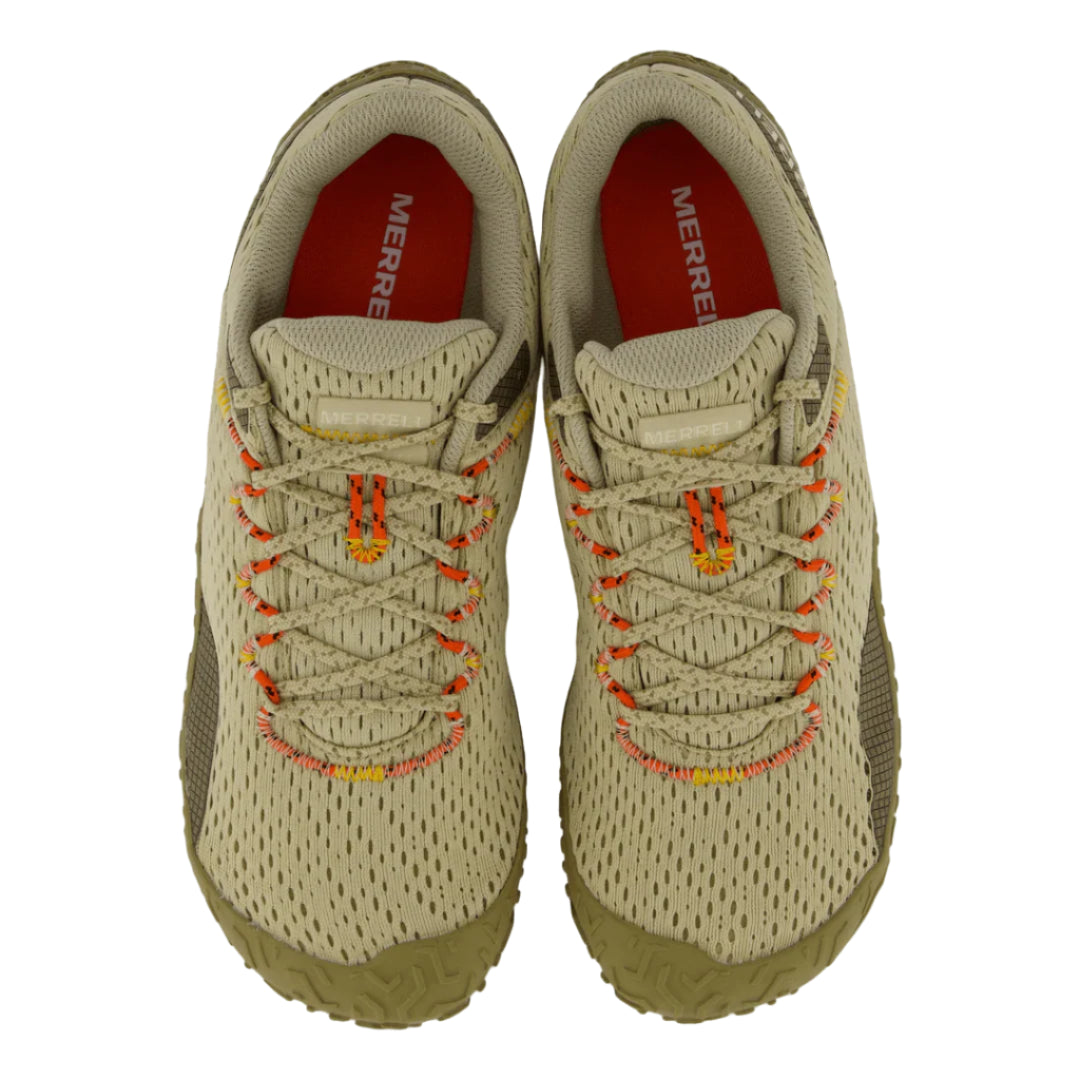 Pair of beige sneakers with orange stitching on a white background