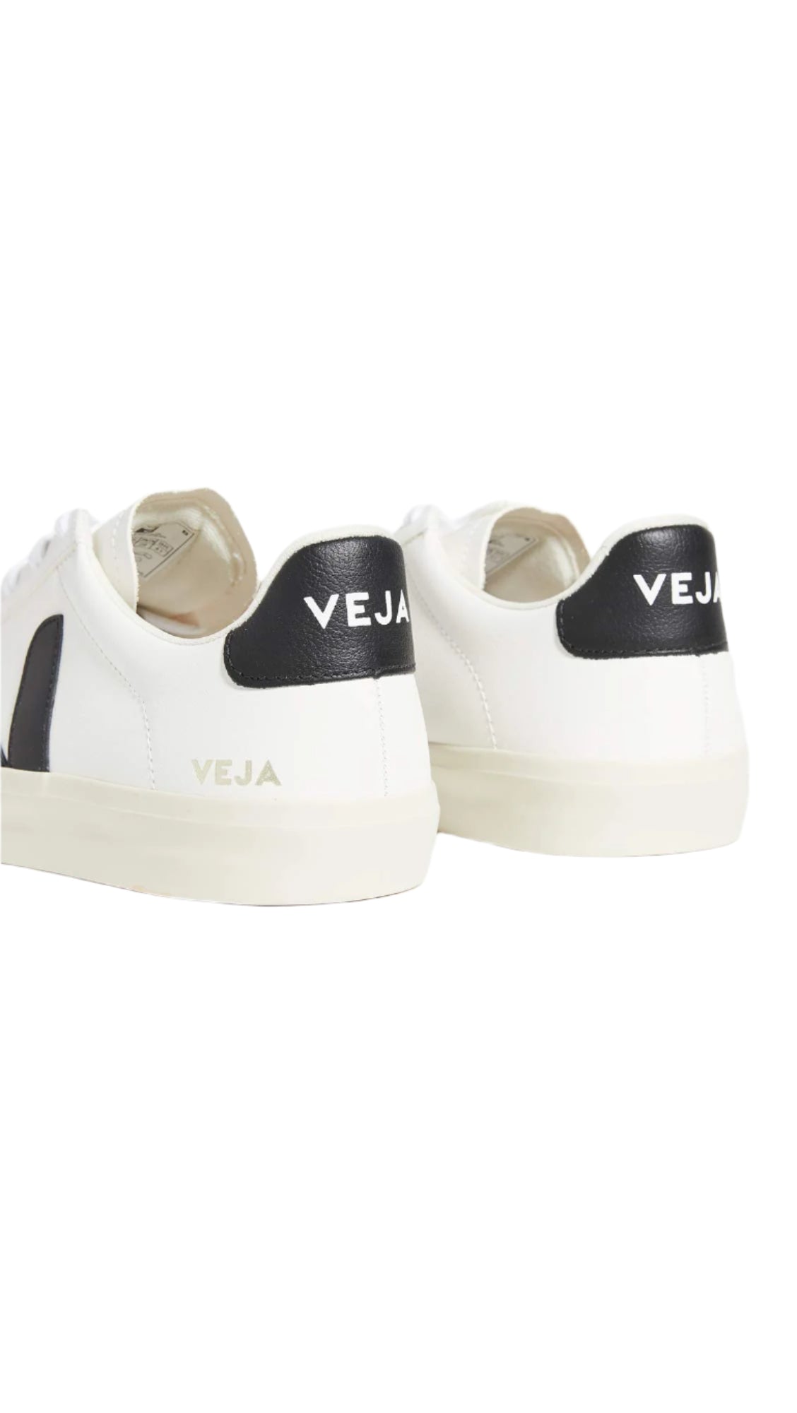 White sneakers with black accents and 'VEJA' branding on a white background