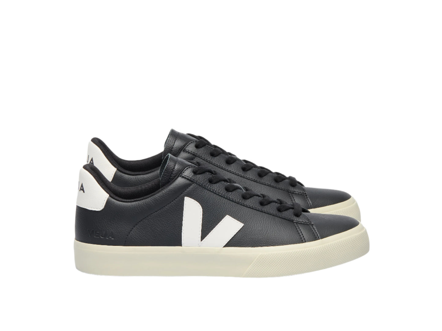 Black sneakers with white logo on a light gray background