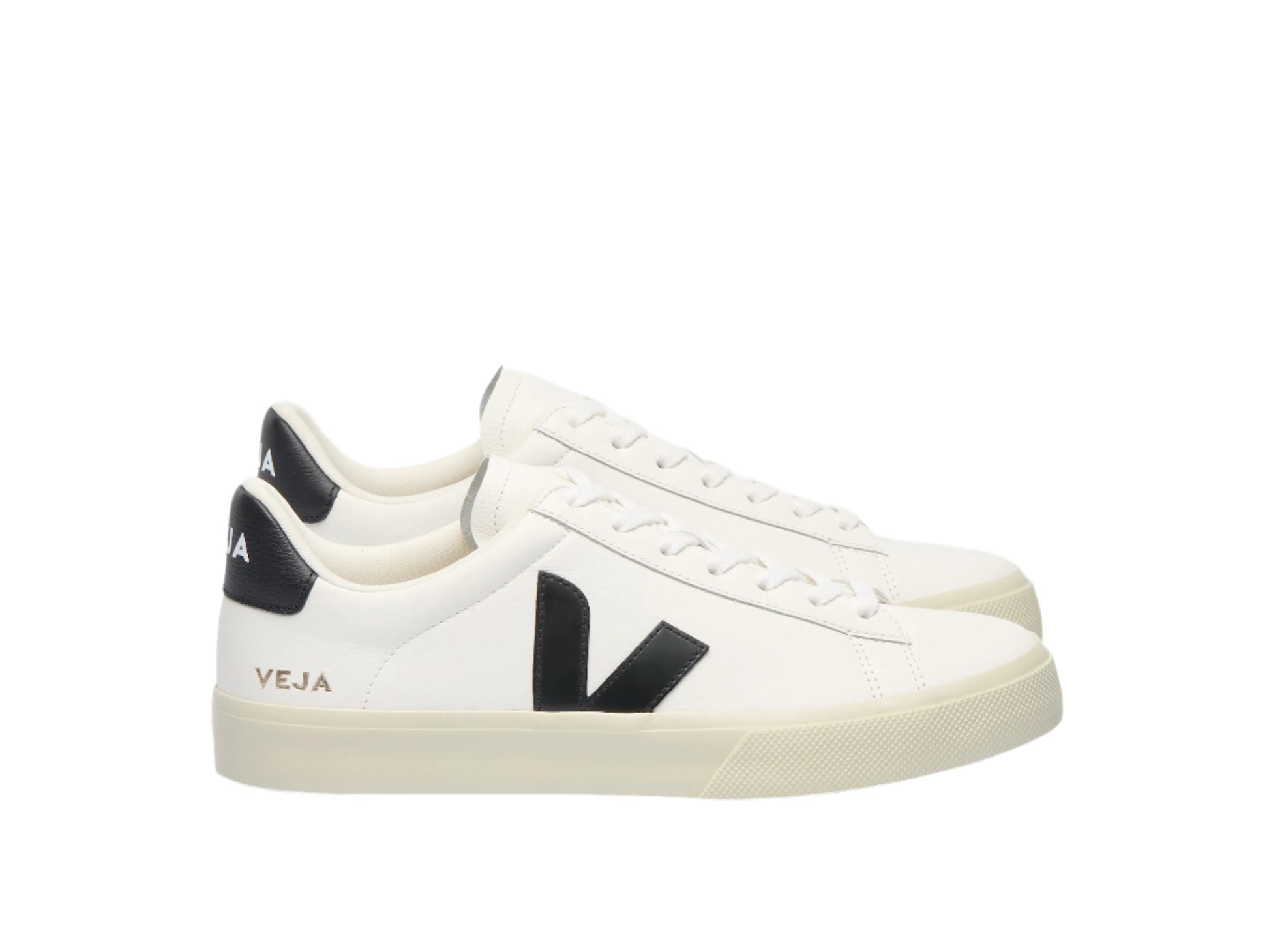 White sneakers with black accents on a light gray background