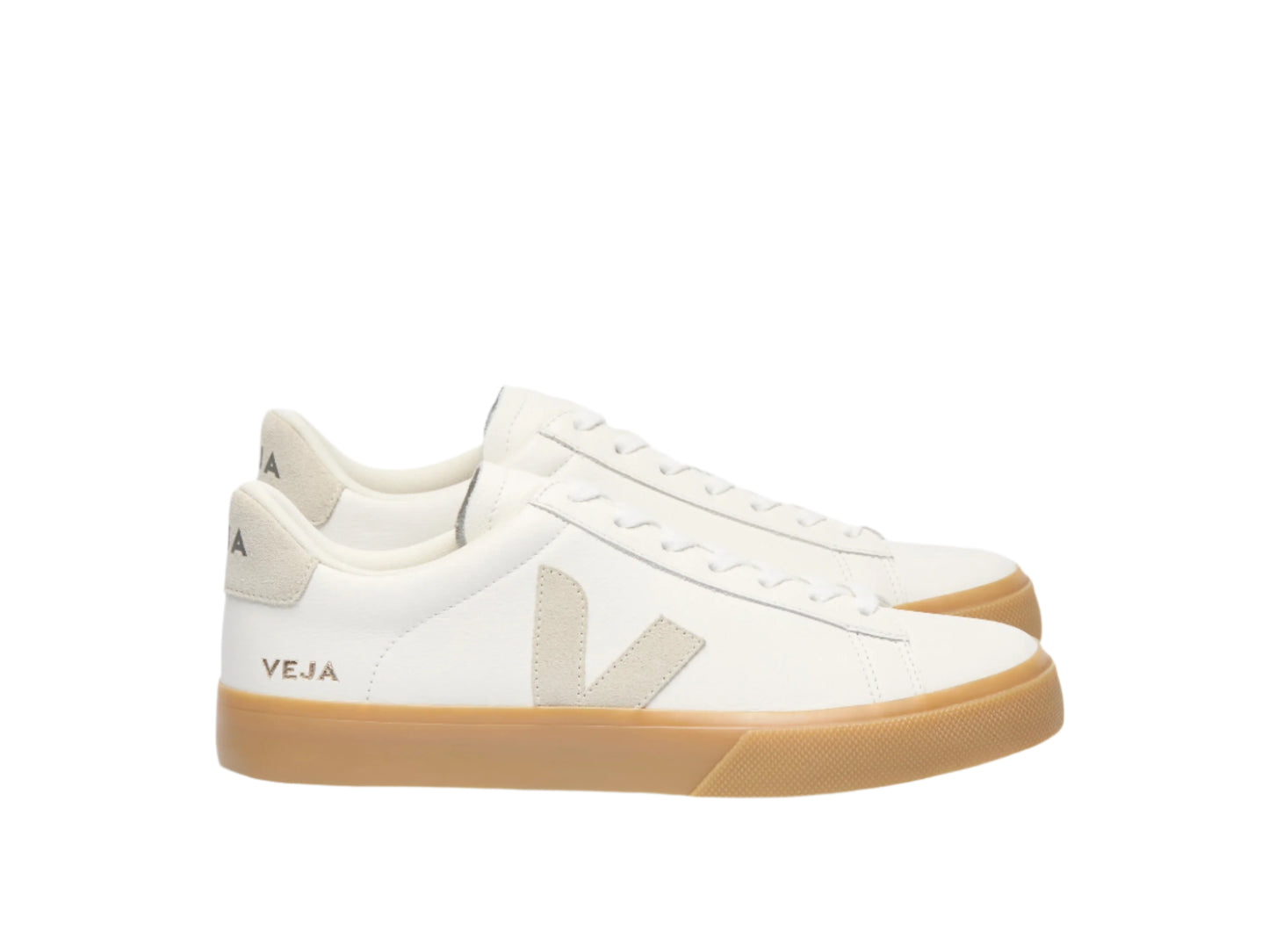 White sneakers with tan soles on a white background