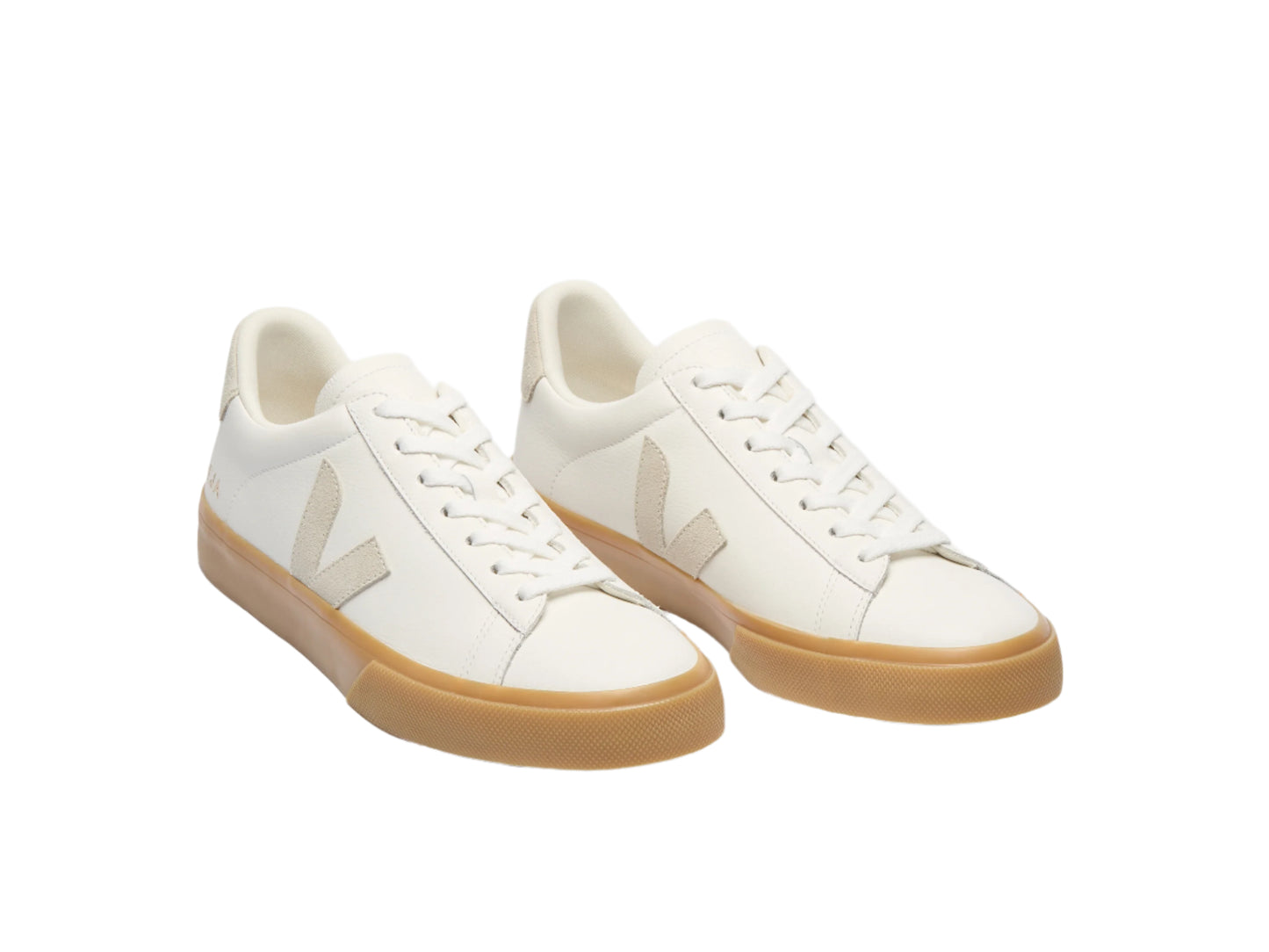 White sneakers with tan soles on a white background