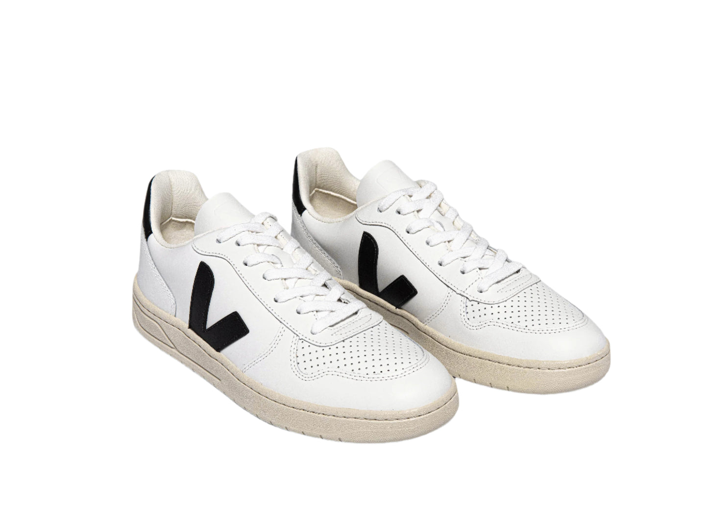 White sneakers with black 'V' logo on a white background