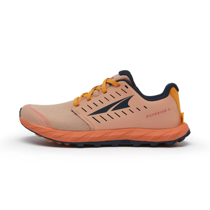 Beige and orange running shoe with brand logo on a white background