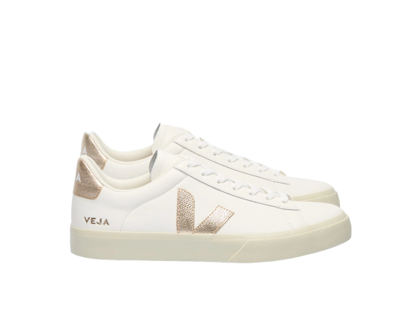 White sneakers with gold accents on a white background