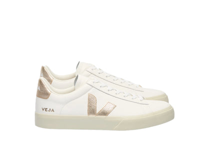 White sneakers with gold accents on a white background