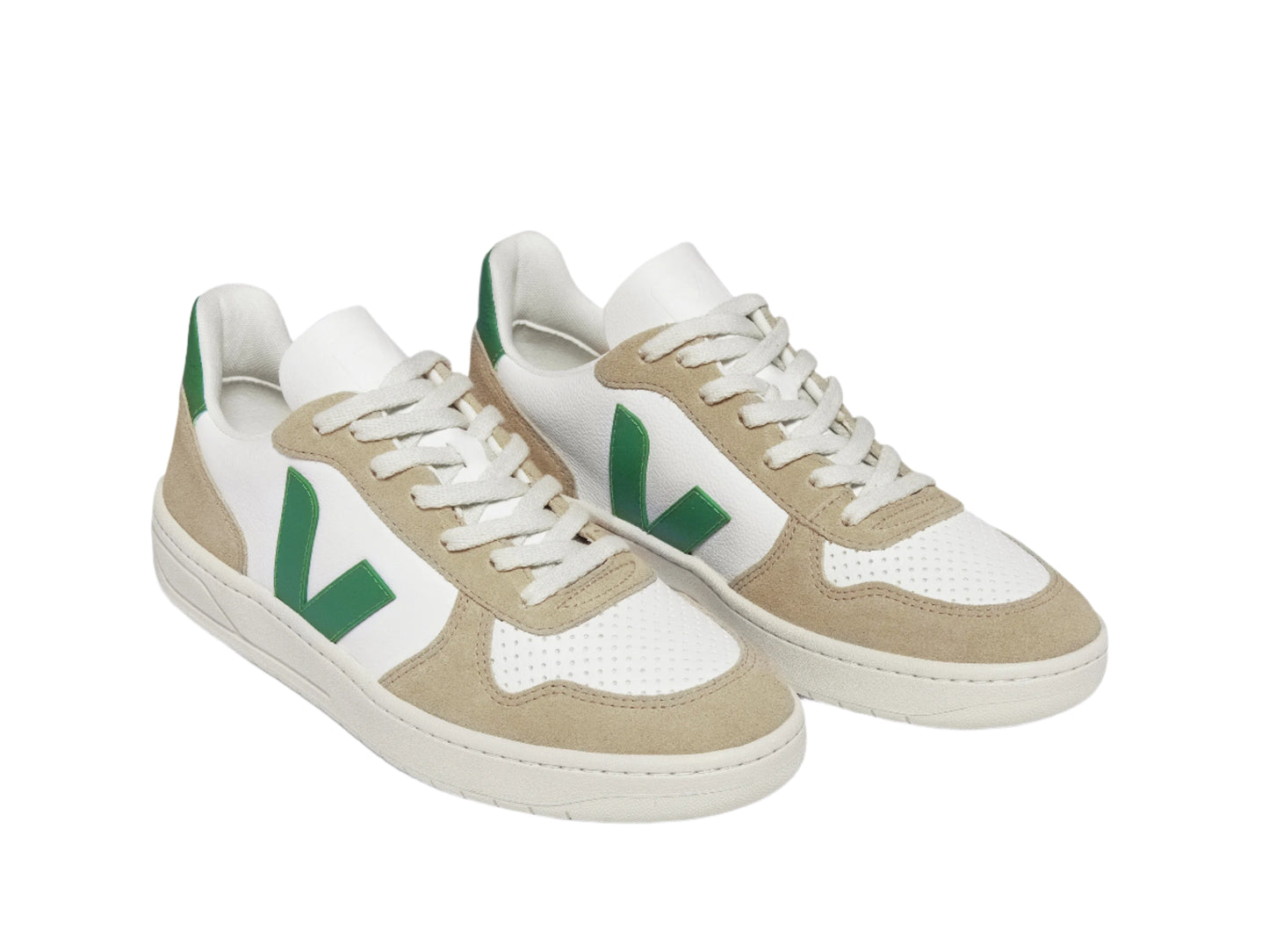 Pair of beige and white sneakers with green accents on a white background