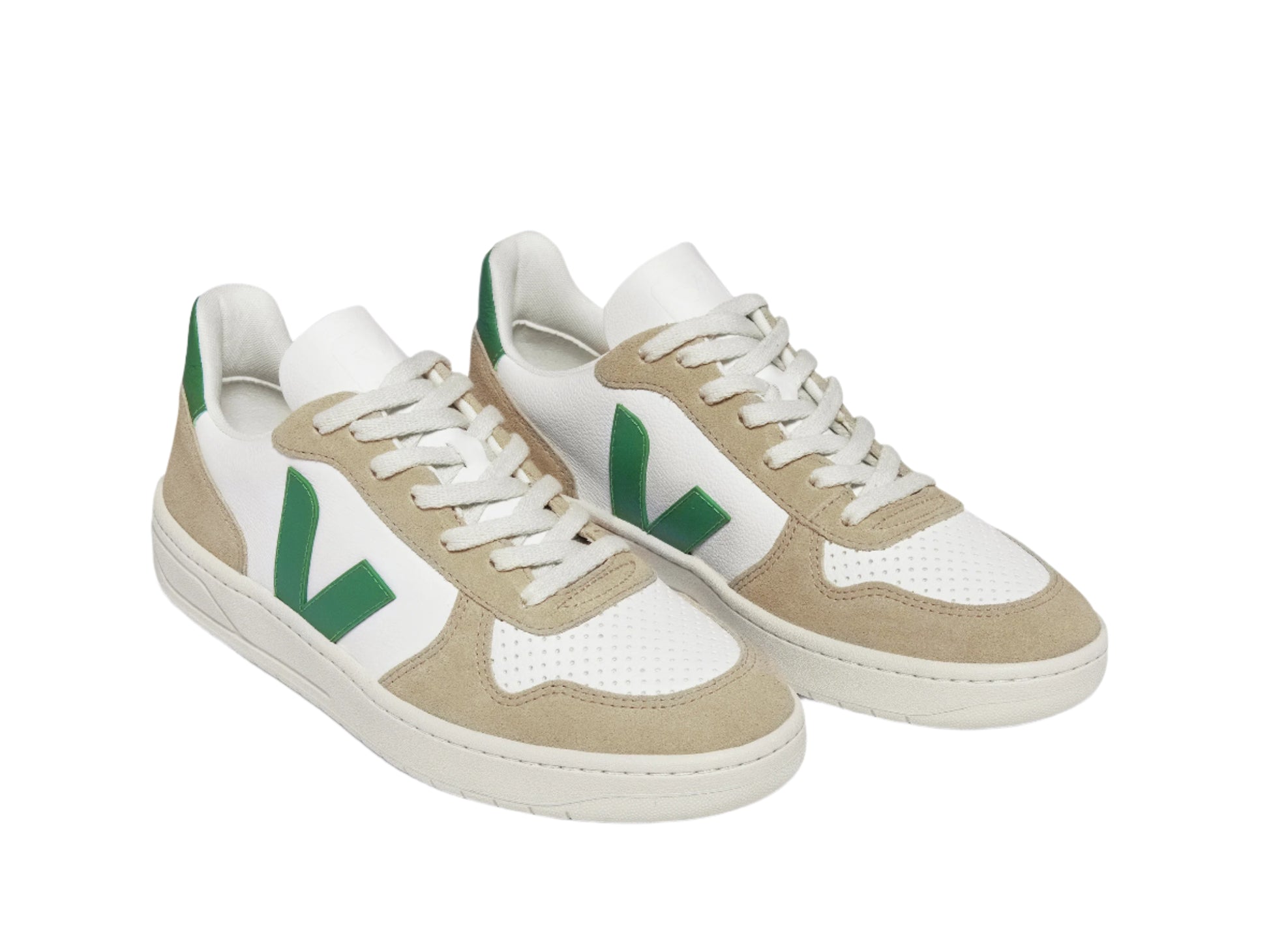Pair of beige and white sneakers with green accents on a white background